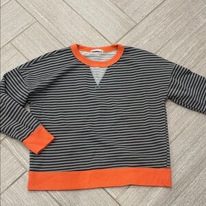 Staccato Striped Black and Gray Sweater with Orange Accents